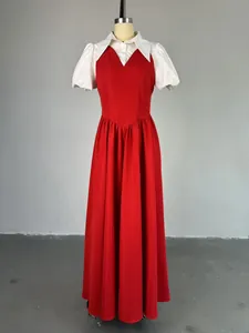 Elegant red high-waist maxi dress with white puff sleeves and shirt collar detail