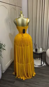 Elegant yellow tiered pleated maxi dress with spaghetti straps and high waist back view
