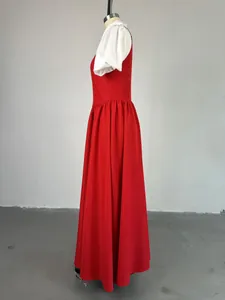 Full-length side profile of elegant red and white faux two-piece dress on mannequin