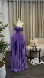 Detailed shot of the pleated bodice and high-waisted design of purple camisole maxi dress