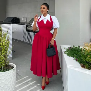 Full length shot of the elegant red faux two-piece dress with white puff sleeves and collar