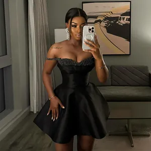Elegant black strapless mini dress with sequin trim and flared satin skirt for women.