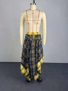 Detail of high-waist yellow plaid skirt with irregular hem and front tie design