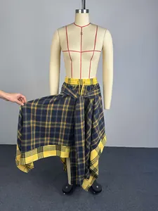 Detail view of a plaid A-line skirt with an irregular hem and tie-front waist on a mannequin.