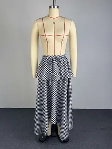 Close-up of black and white gingham midi skirt featuring irregular hem on a mannequin
