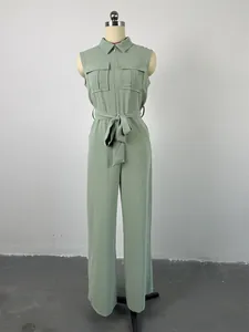 Sage green sleeveless jumpsuit with lapel collar, chest pockets, and waist tie belt.