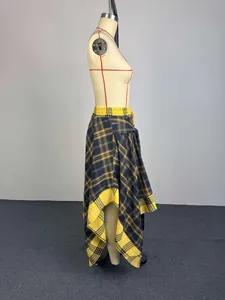 Side view of stylish yellow and black plaid asymmetrical skirt on a professional mannequin