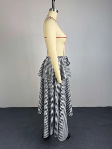 Side view showing layered ruffles and irregular hem of geometric print midi skirt