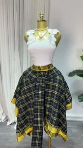 Detail showing high-waist plaid A-line skirt with irregular hem and tie-up belt