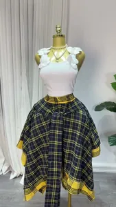 Detailed view of irregular plaid A-line skirt with high waist and decorative tie belt.