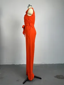 Full side profile view of a vibrant orange sleeveless wide-leg jumpsuit on a mannequin.