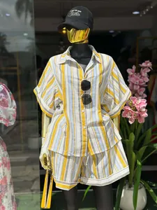 Full view of the striped short-sleeve shirt and high-waist shorts set on a mannequin