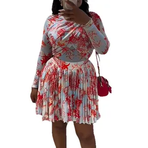 Conjunto de dos piezas para mujer con top de manga larga y falda plisada con estampado