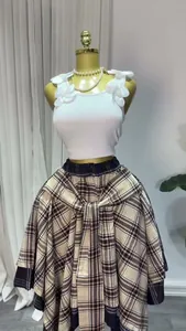 Close-up detail of a plaid A-line midi skirt featuring a high waist and tie-waist design