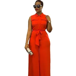 Orange sleeveless wide leg jumpsuit featuring lapel collar, chest pockets and waist tie