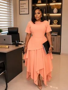 Elegant peach short-sleeve midi dress featuring a stylish irregular layered hemline detail