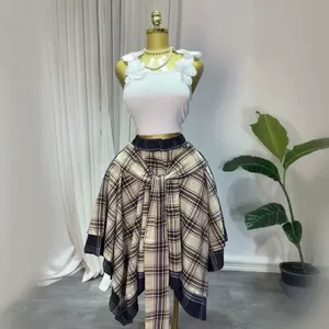 High-waisted brown plaid asymmetrical A-line skirt with decorative tie-front design