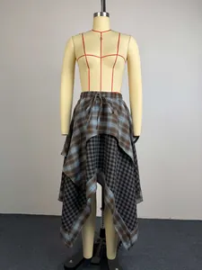 Detail view of double-layered irregular plaid skirt with drawstring waist on mannequin
