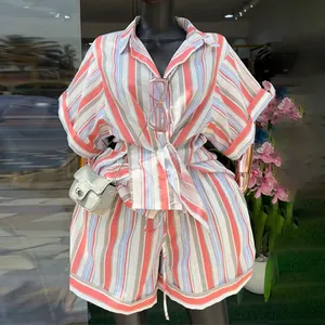 Women's summer two-piece set featuring a striped short-sleeved shirt and high-waisted shorts (89 chars)