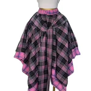 High-waisted plaid A-line skirt featuring an asymmetrical hem and tie-front detail.