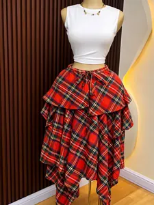 High-waisted red plaid irregular A-line midi skirt with tie waist on mannequin