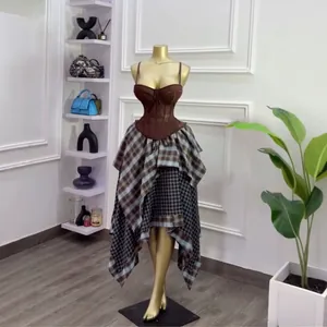 Chic two-piece summer set featuring a brown corset top and asymmetrical plaid tiered skirt