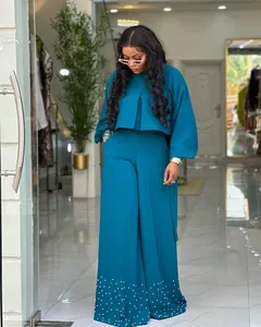 Elegant teal two-piece outfit featuring a lantern sleeve top and pearl-beaded wide-leg pants