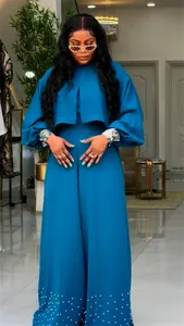 Elegant blue two-piece set with lantern sleeves and beaded wide-leg trousers for women