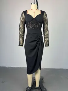 Elegant black midi dress featuring lace long sleeves and a stylish ruched skirt design