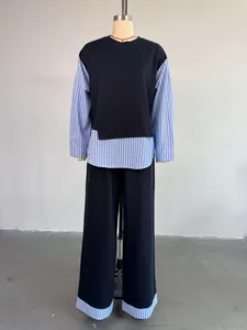 Elegant casual women's navy blue and striped patchwork two-piece suit on mannequin