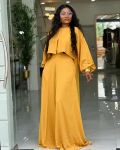 Chic mustard yellow two-piece set with lantern sleeve top and beaded wide-leg pants