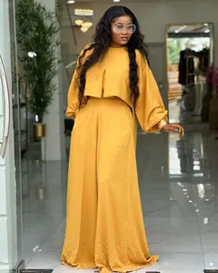Elegant two-piece yellow summer set featuring lantern sleeve top and pearl beaded wide-leg pants