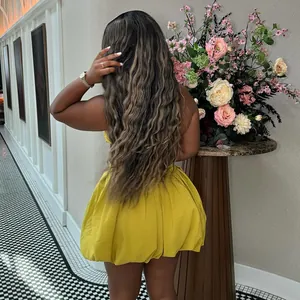 Back view of elegant yellow halter backless bubble dress showing high waist detail
