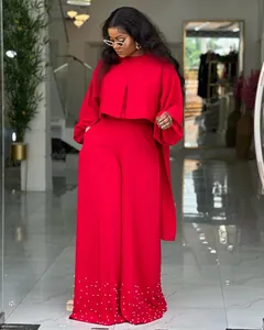 Elegant red two-piece outfit featuring lantern sleeves and pearl-studded wide-leg pants