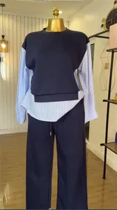 Two-piece casual suit featuring a striped patchwork sweatshirt and wide-leg pants.