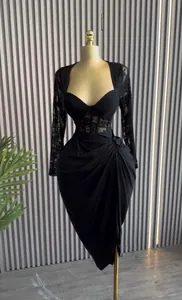 Elegant black lace long sleeve midi dress with sweetheart neckline shown on mannequin