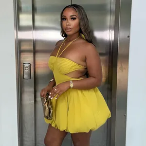 Stunning yellow halter neck backless bubble mini dress presented on a female model