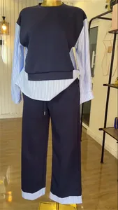 Close-up detail of fashionable navy blue striped patchwork top and wide-leg trousers lounge set