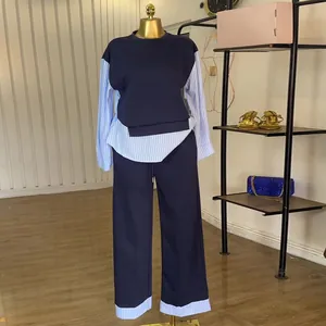 Full view of navy blue casual set with striped patchwork details on mannequin