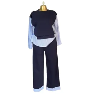 Two-piece navy set featuring striped patchwork top and high-waisted wide-leg pants.