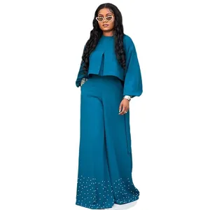 Elegant teal two-piece set featuring lantern sleeve top and beaded wide-leg pants for women