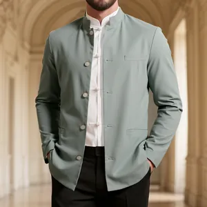 Detail of a sage green men's mandarin collar blazer with cotton-linen texture.