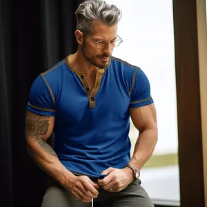 Close-up detail of a premium men's blue short sleeve Henley t-shirt with gold trim accents