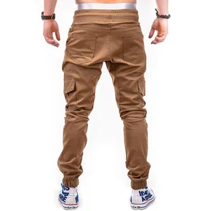 Detailed back view of men's brown cargo jogger pants with elastic cuffs and large pockets