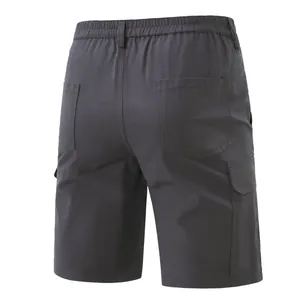 Rear view of dark grey men's cargo shorts with elastic waist and patch pockets
