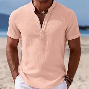 Close-up of men's salmon cotton linen shirt with mandarin collar in beach setting