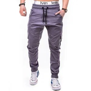 Detail view of men's grey cargo jogger pants with elastic drawstring waist and side pockets