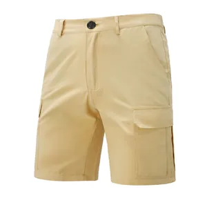 Close-up detail of men's khaki cargo shorts featuring multiple functional pockets