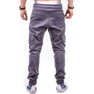 Back view of men's grey solid color cargo jogger pants with practical side pockets