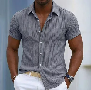 Close-up of men's grey textured short-sleeve shirt showing vertical seersucker fabric.